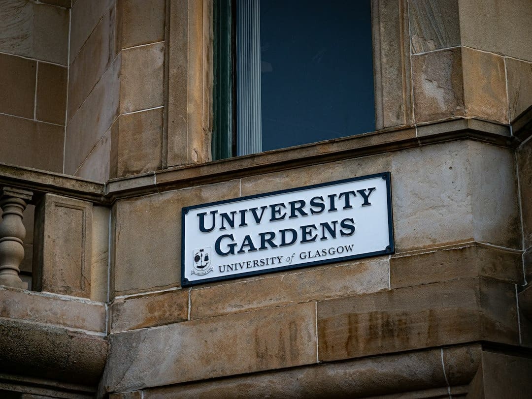University Gardens sign on a stone building.