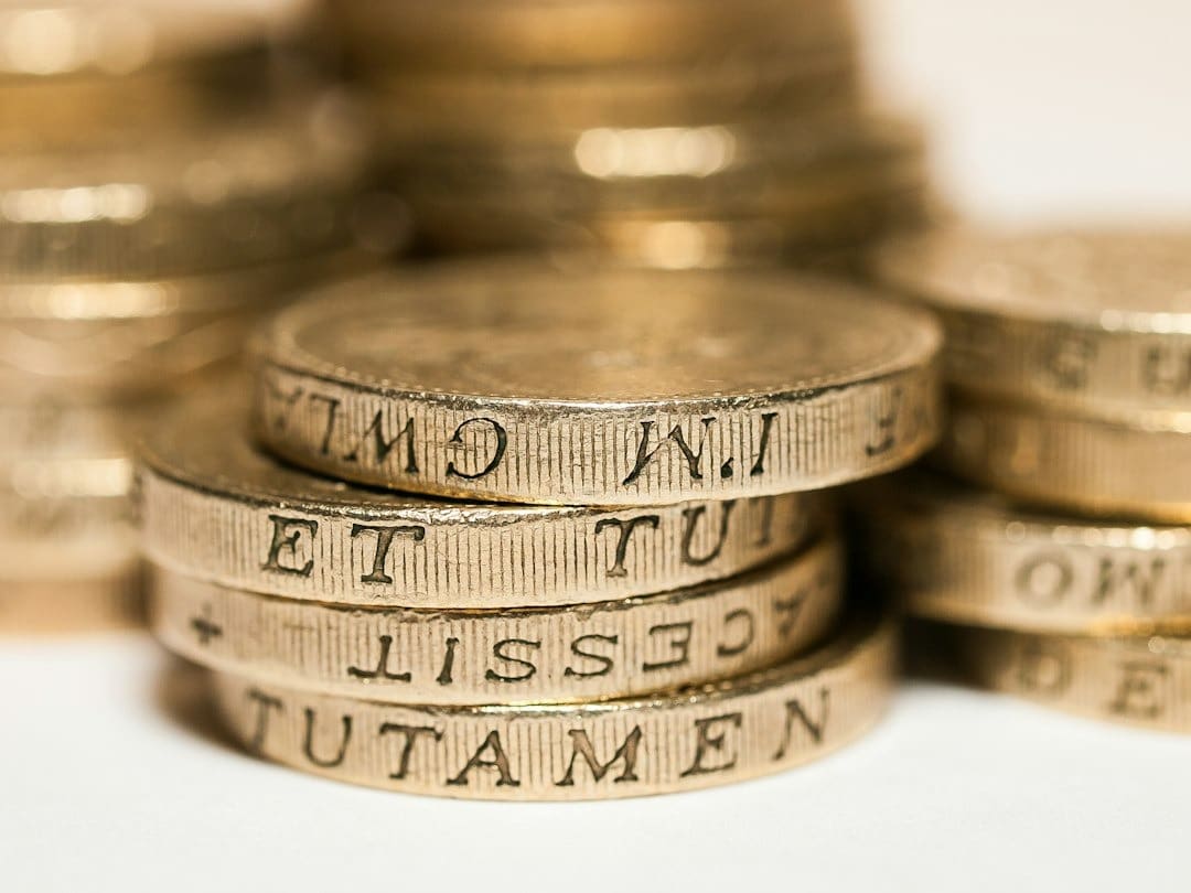Stacks of gold coins representing finance and accumulation.